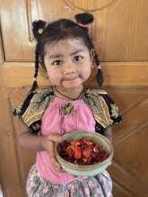 Aliyah enjoying goodies from the solar dryer!