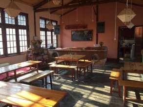 Main room of the new cafe with earthen counter