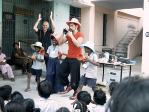 Clown and Magician volunteers performing