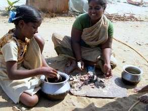 Mother and girl child cleaning the crab for a meal