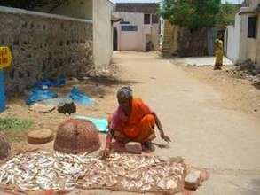 Women making dry fish