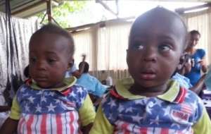 Cutie twins a little unsure of the Doctor