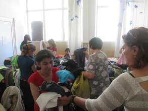 Director Helping to Hand Out Clothing