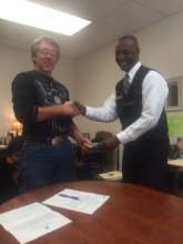 Program Participant receiving a gas card.