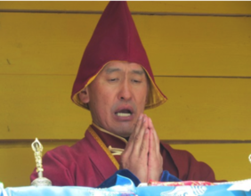 Buddhist Monk praying at Snow Leopard ceremony