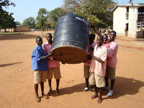 Boys Carrying Tank For School
