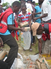 Photo of SACRENA supporting orphans with food