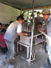 Making Cinder Blocks for houses, latrines, stoves,