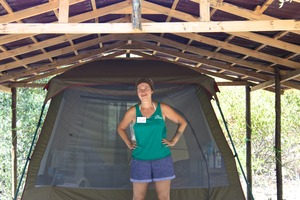 Our volunteer Anne in front of her tent!