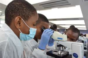 STEPS primary school students using microscope