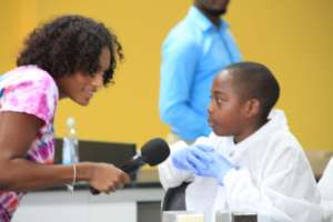 Dr. Webster interviewing a primary school student