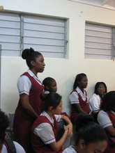 One of the young ladies raises a question