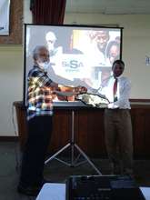 Prof. Reese accepts a token from Oberlin High