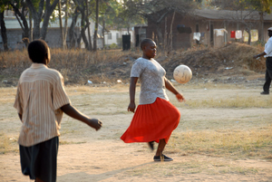 Mama Ann takes times off her busy schedule to play some soccer