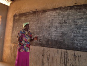 Teacher Claudencia teaching displaced children