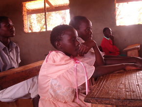 Pupils attentively listening in class