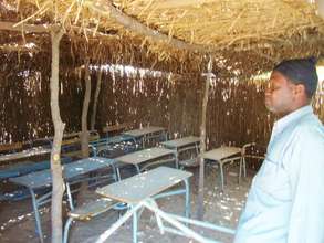 A teacher surveys his classroom