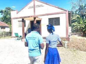 LFBS staff member and student at school