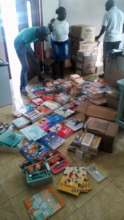 Staff sorting and stamping school books