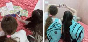 Two sisters with school supplies