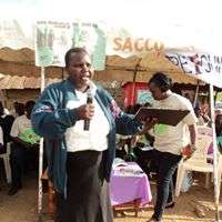 Gladys with Anti-FGM messages at a market event