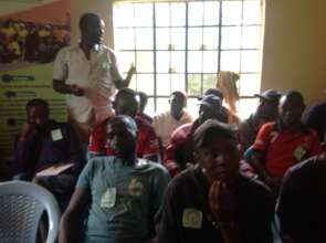 Men discussing their role in ending FGM