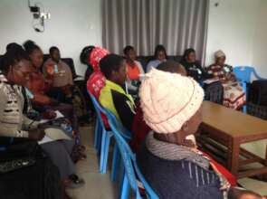 women attentively participate in the IWD training