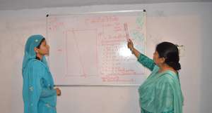 Instructor Ruksana Bano with a student