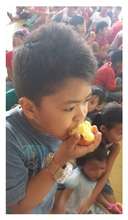 A Filipino Boy Eating An Apple 02