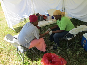 Counsellor drawing a blood sample for HIV testing
