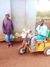 Bongiwe accepting a food/nutrition package
