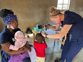 Nurse volunteer seeing patients