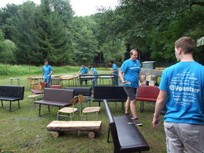 Volunteers help with preparations for the camp.