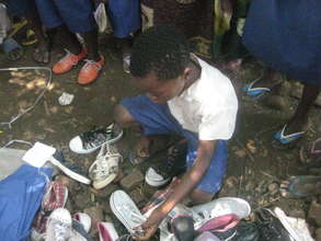 Students select the shoes that fit them best.