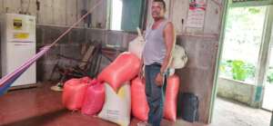 Jose Luis another group member showing his corn