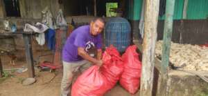 Adan getting ready to dry out his corn seed