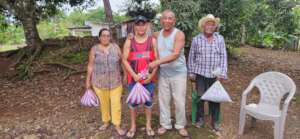 Emilio distributing the corn seed donated by SHI