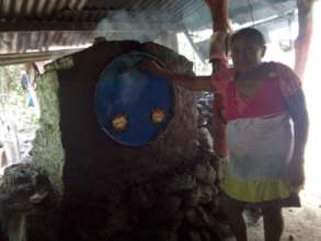 Martiza showing her new oven.
