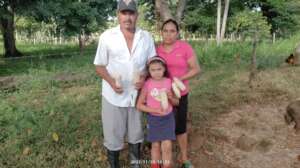 Erling showing the corn with his family