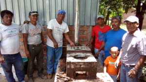 Fathers join SHI staff to help construct stoves