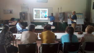 locals receive a presentation about the stoves