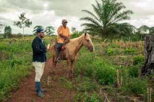 Pedro sharing information with the Program Officer