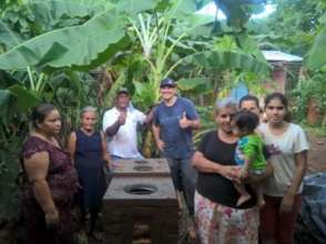 volunteers building improved stove
