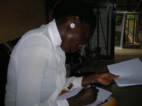 Eve writing a letter to her Globalgiving helpers