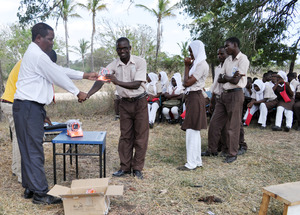 Distributing Solar Lamps to students at Buyani