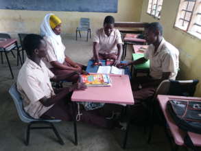 Thambo in a group discussion with his classmates