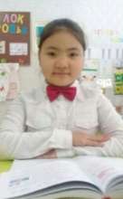 Mary in her classroom ready to study