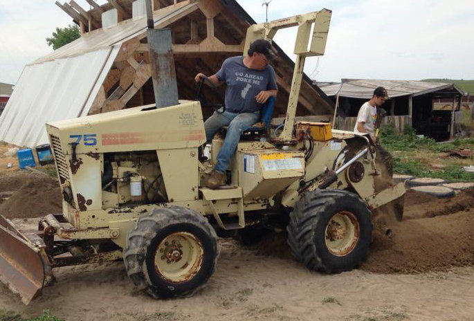 Bryan Deans backfilling on the build site
