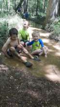 Isaiah (blonde hair) in the mud!