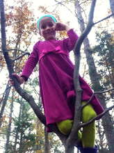 Rita chewing a pine needle after climbing a tree